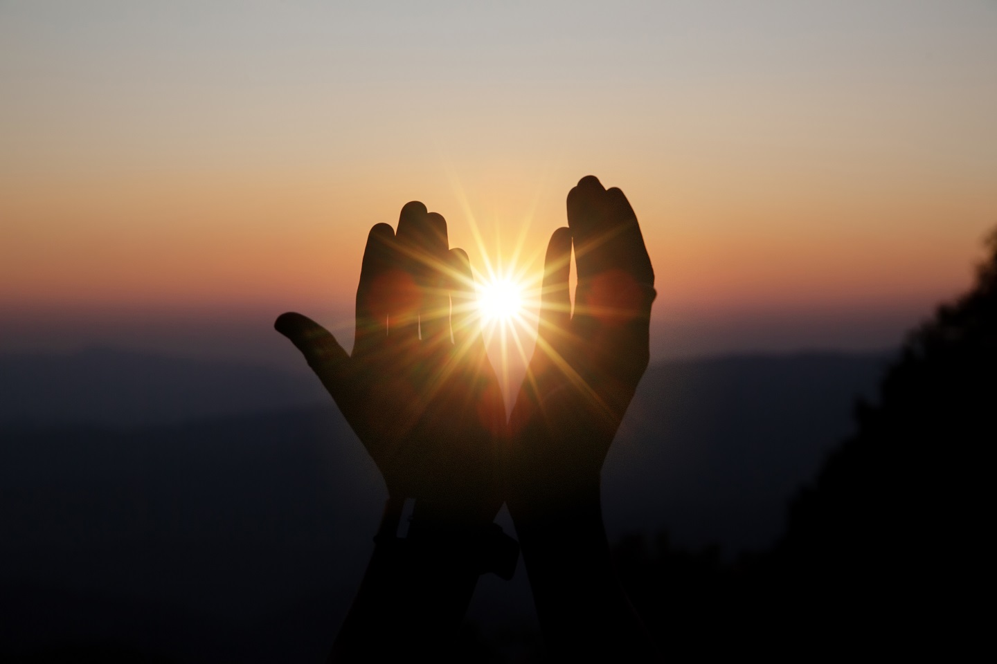 spiritual-prayer-hands-over-sun-shine-with-blurred-beautiful-sunset.jpg